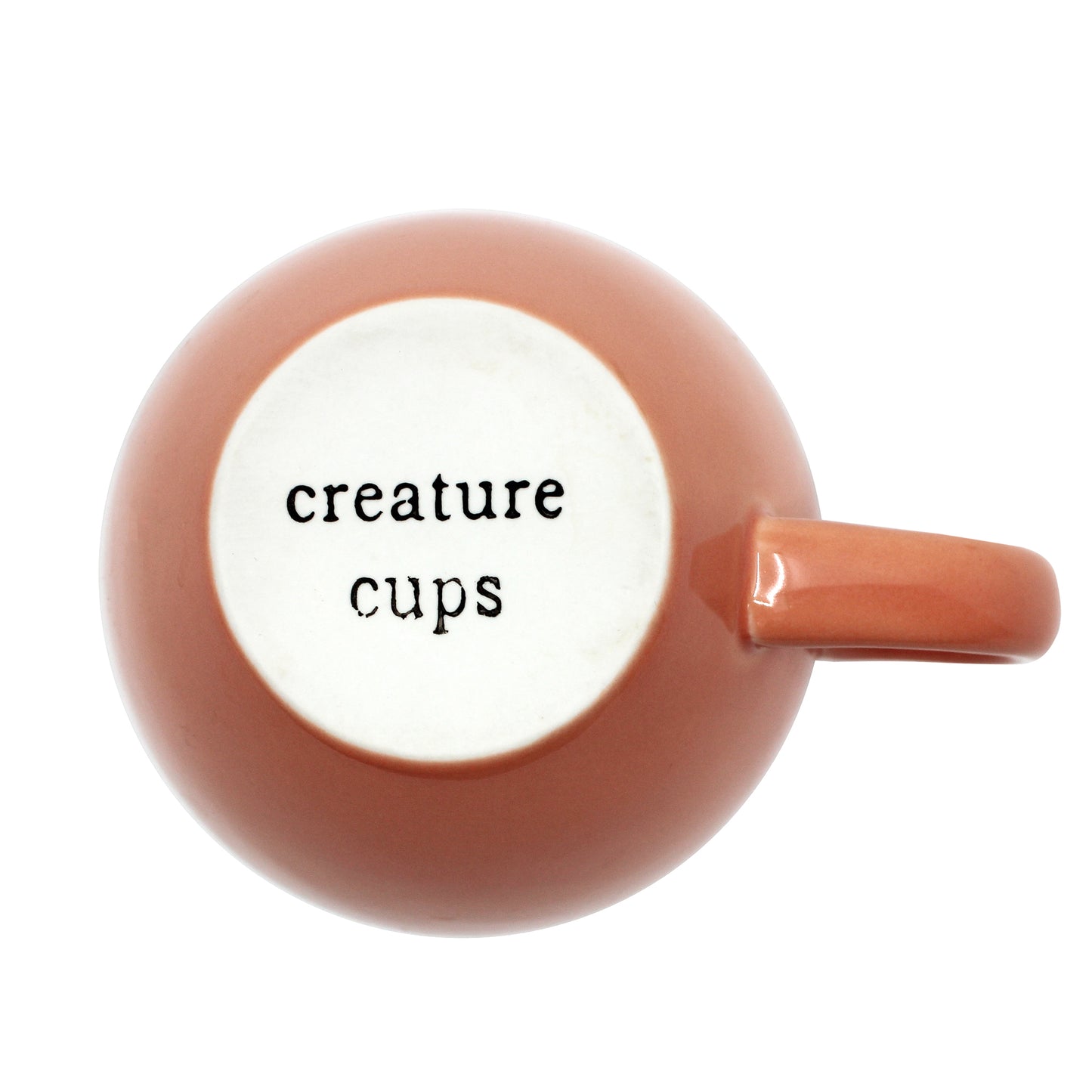 Exterior bottom of Peach colored Creature cup with 'creature cups' printed on it