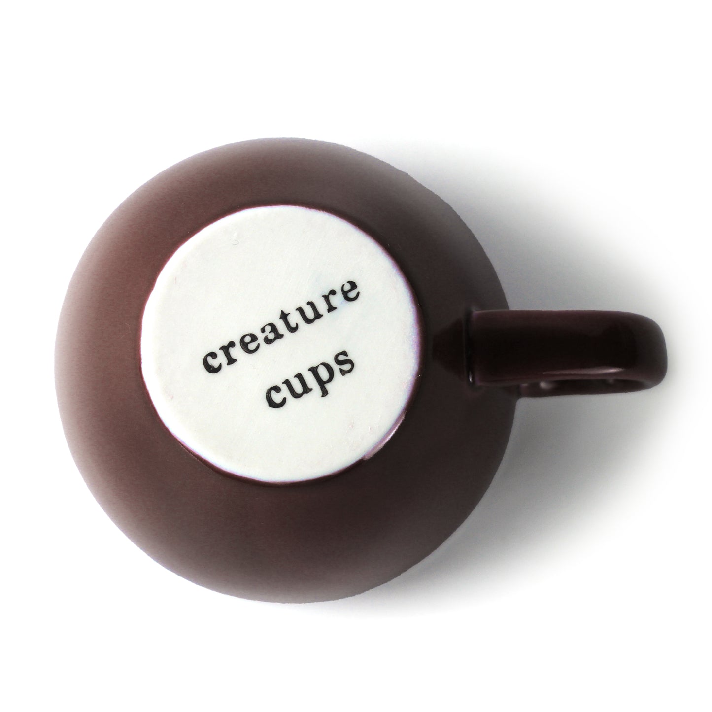 Dark brown Creature Cup bottom exterior