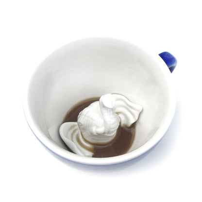 Cobalt blue Elephant Creature Cup interior partially submerged