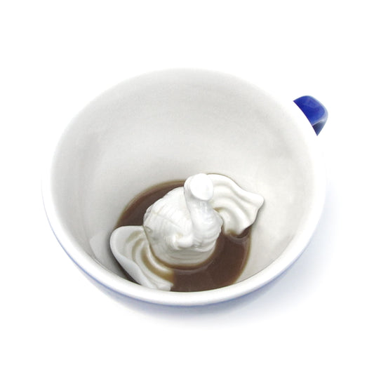 Cobalt blue Elephant Creature Cup interior partially submerged