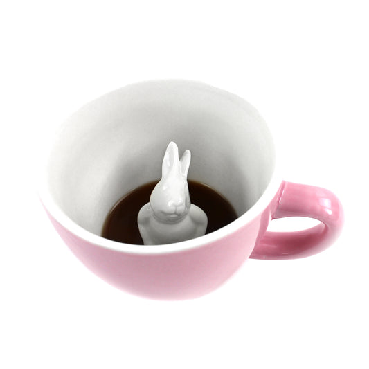 Blush pink rabbit Creature Cup interior partially submerged