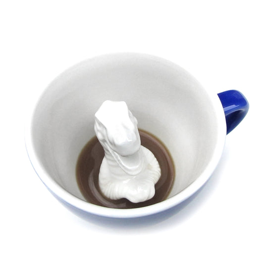 Cobalt blue T-Rex Creature Cup interior partially submerged